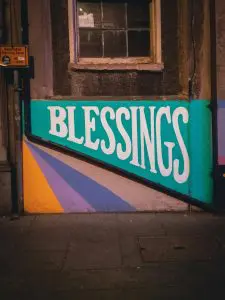 a brightly colored sign with the word BLESSINGS