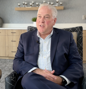 A close up for Jeff Thorne, CEO and President sitting in a chair in our Gardenview room.