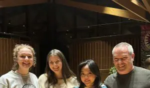 three female Macalester College students with their professor Ron Barrett
