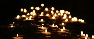 A variety of candles burning in the night