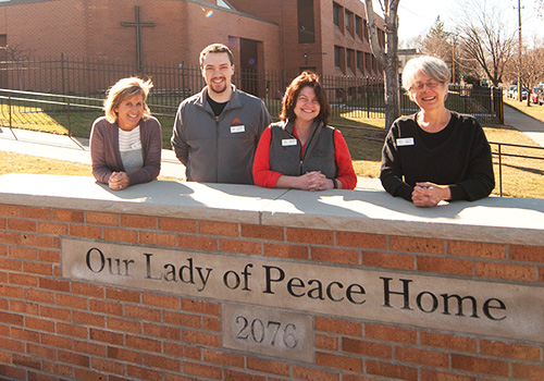 Our volunteers pose outside our Residential Hospice.